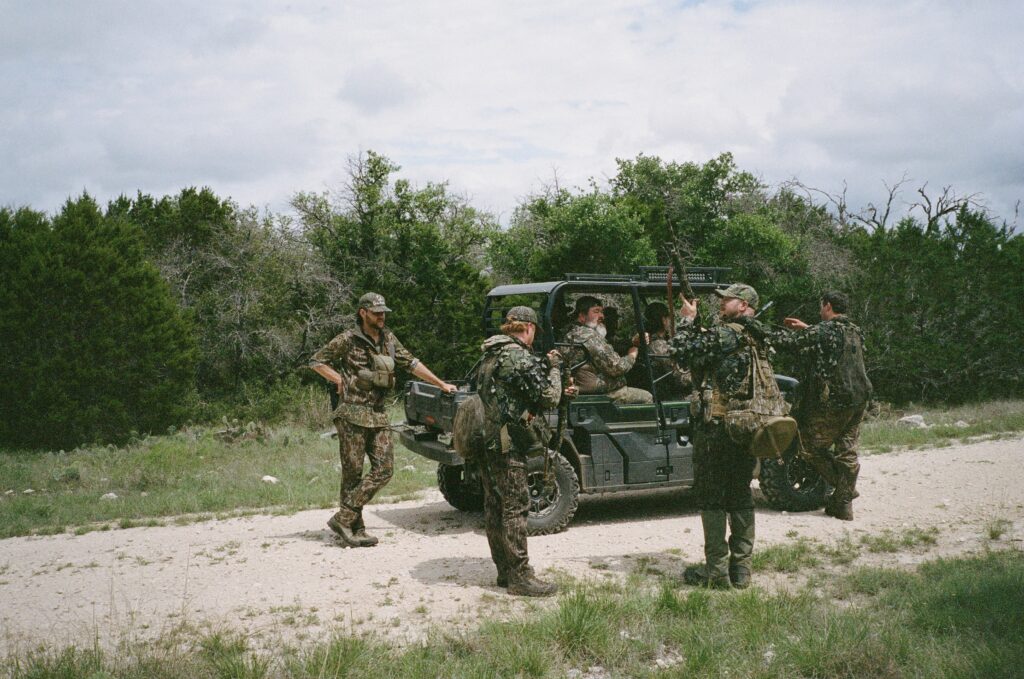 Hunters load into a off-road vehicle.