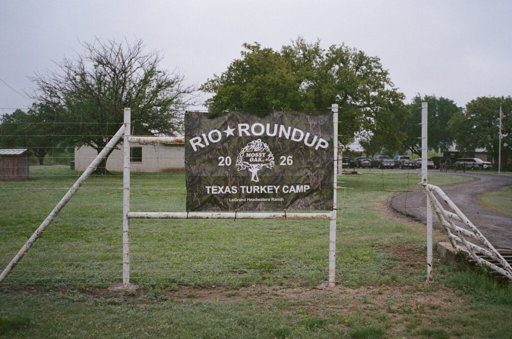 A sign reading "Rio Roundup" in a front lawn