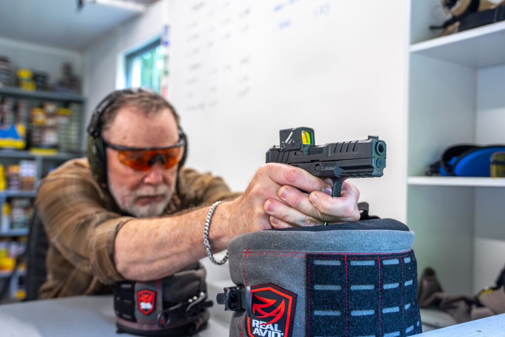 A shooter fires the new Springfield-Armory Echelon pistol from a bech rest.