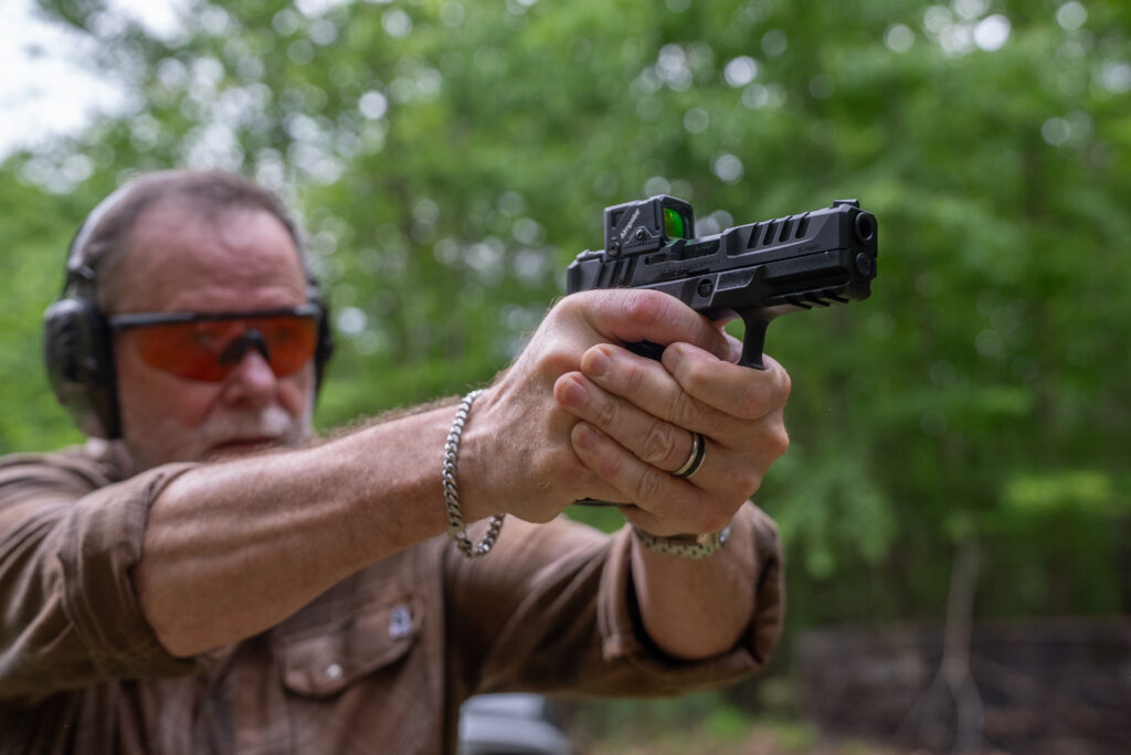 A shooter fires the new Springfield-Armory Echelon piston on an outdoor range. 