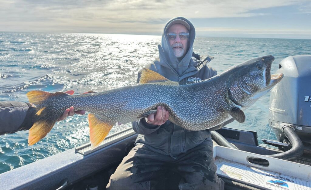 Angler Boats Giant State-Record Lake Trout in Minnesota An angler poses with a state-record lake trout caught in Minnesota.