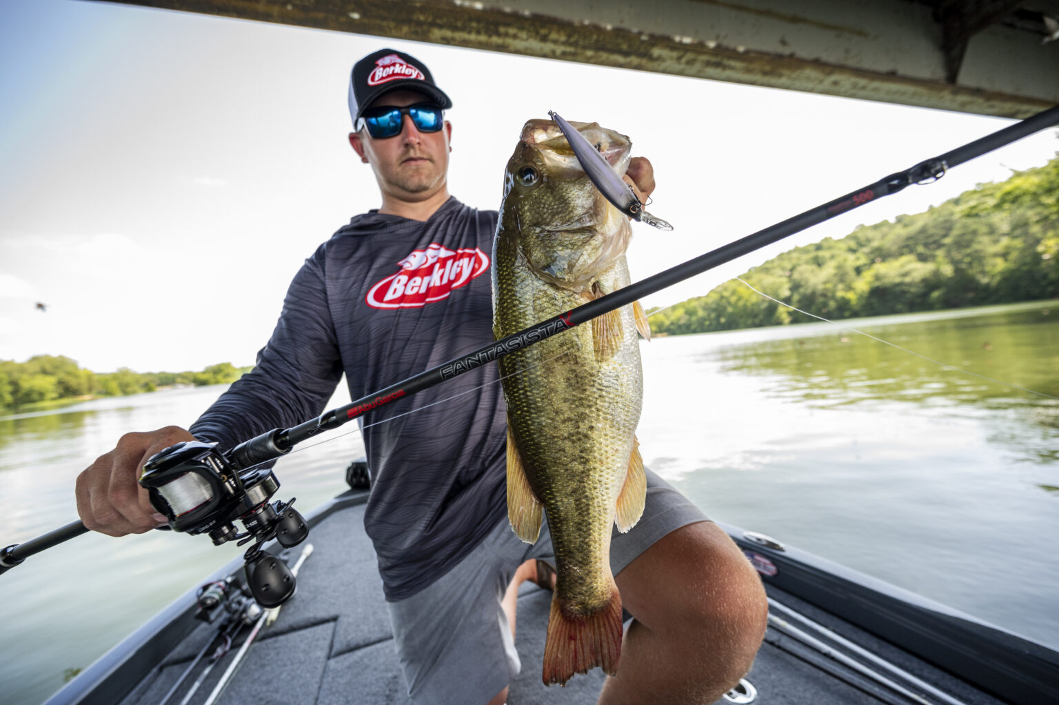 Angler holds up a largemouth with a jerkbait