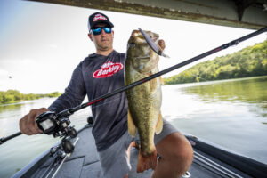 Angler holds up a largemouth with a jerkbait