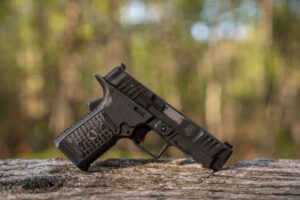 Wilson Combat Bulwark pistol on board in woods
