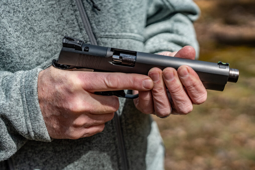Hands hold the new Dan Wesson Kodiak pistiol