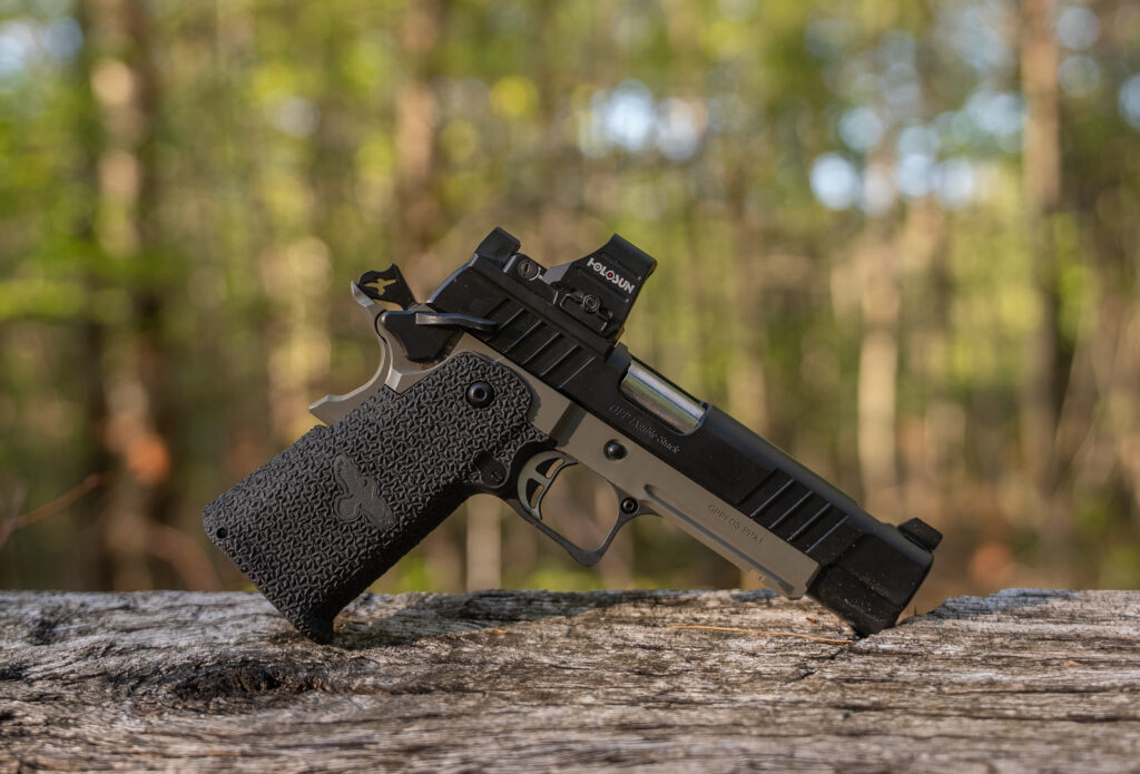 Fink’s Gunsite Performance Pistol resting on a board.