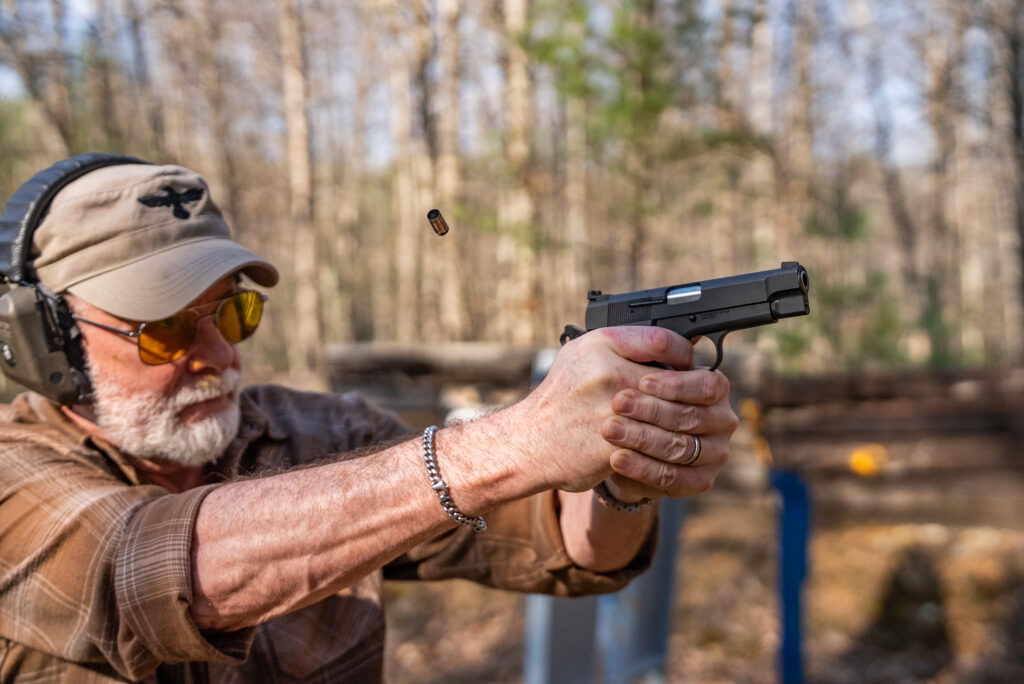 A man shoots the new Springfield-Armory SA-35 4-inch pistol.