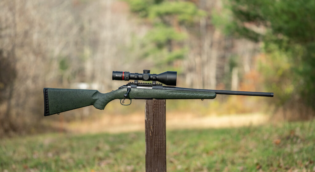 Glenfield Model A rifle balanced on a post in a field