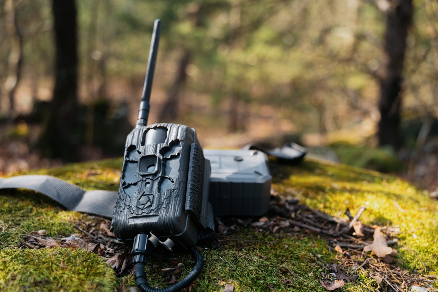 Stealth Cam Deceptor Max 3.0 Cellular Trail Camera Review—Expert Tested Stealth Cam Deceptor Max 3 cellular trail camera on a mossy rock