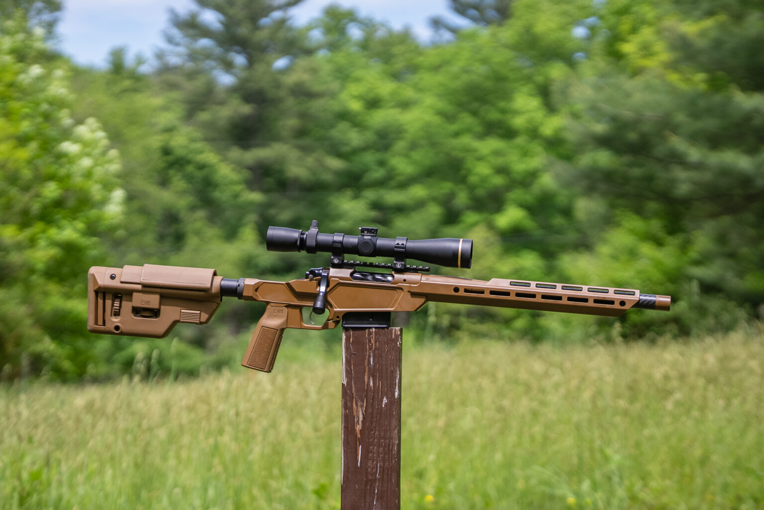 Springfield-Armory Heatseeker rifle balanced on a post in a field
