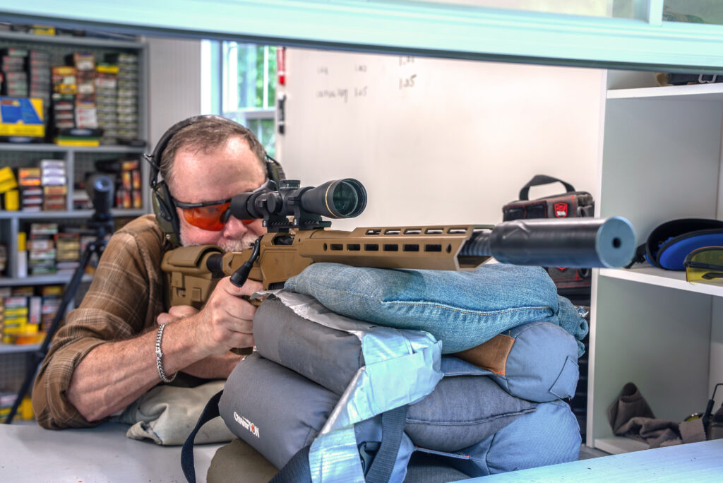 Man shoots the new Springfield Armory Heatseeker rifle at a shooting bench