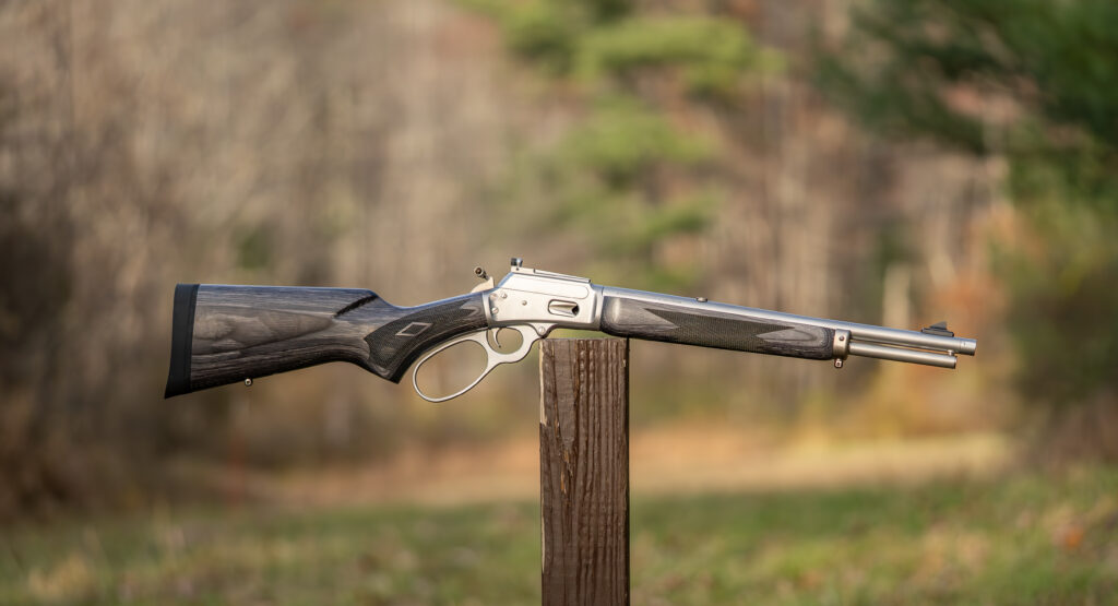 Marlin 1894 Trapper 10mm balanced on a post in a field