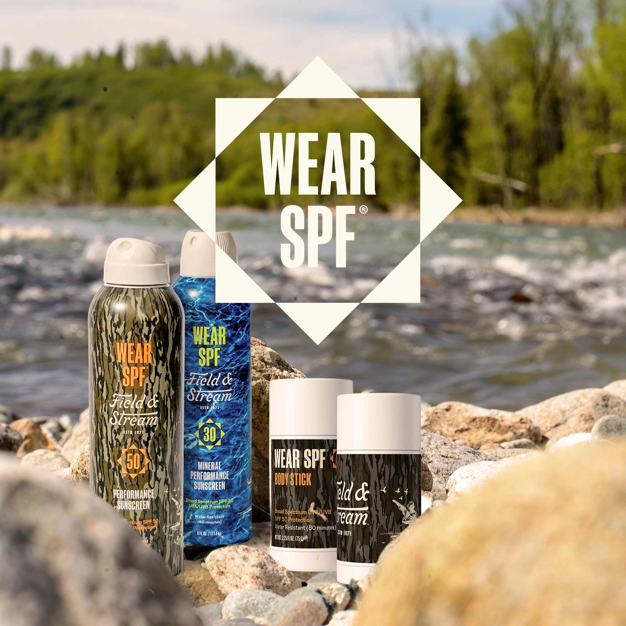 Wear SPF Field & Stream sunscreen products displayed on rocks by a river.
