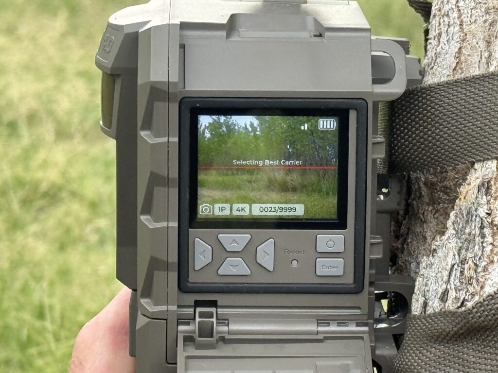The Tactacam Reveal 4.0 Pro camera mounted on the side with LED screen