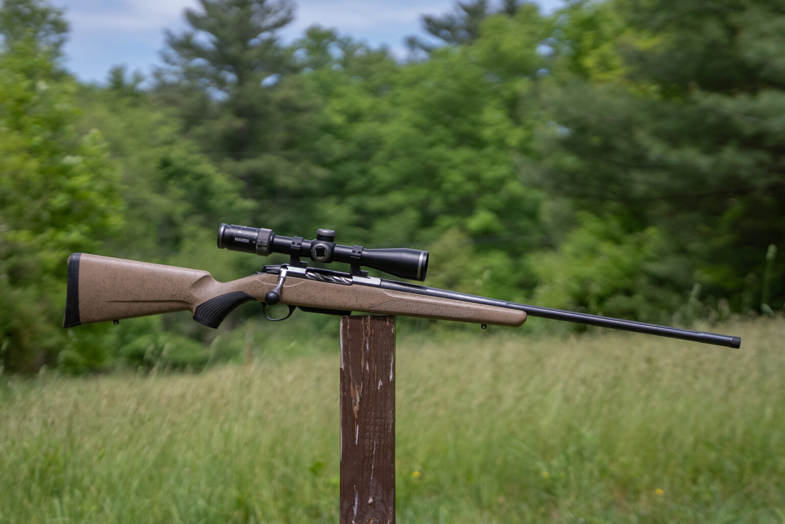 Tikka T3x Lite Roughtech, one of the best rifles on 2026, resting on a post in a field