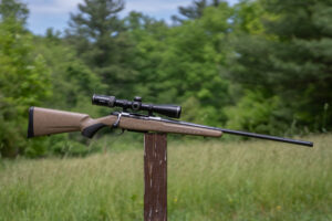 Tikka T3x Lite Roughtech, one of the best rifles on 2026, resting on a post in a field