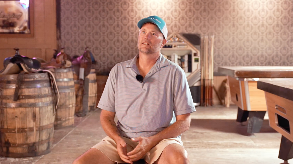 A sweepstakes winner sits for an interview about an upcoming bass fishing tournament. 