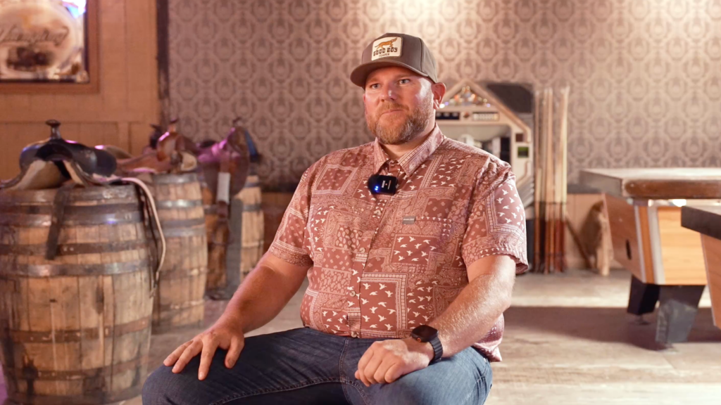 A sweepstakes winner sits for an interview about an upcoming bass fishing tournament. 