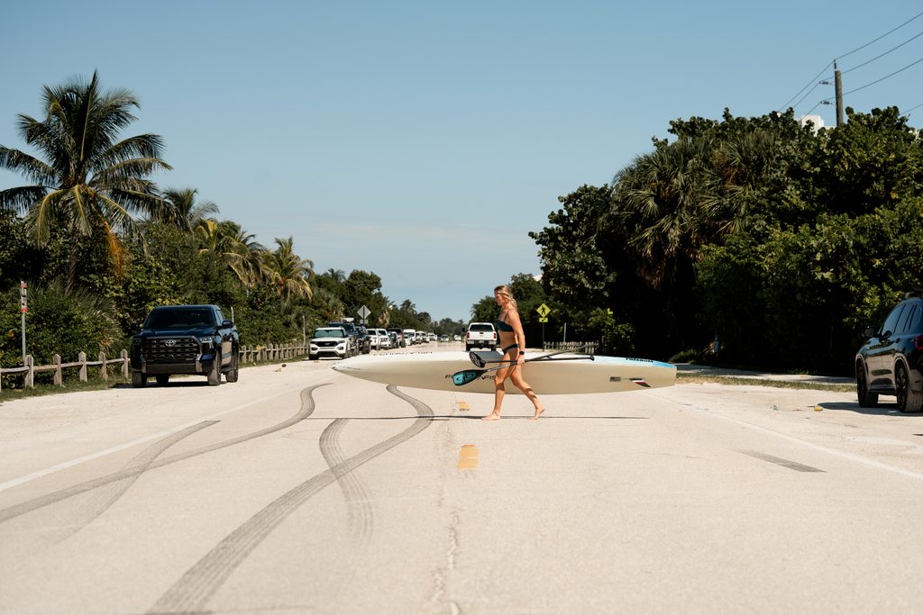 A paddler crosses a highway in Florida. 