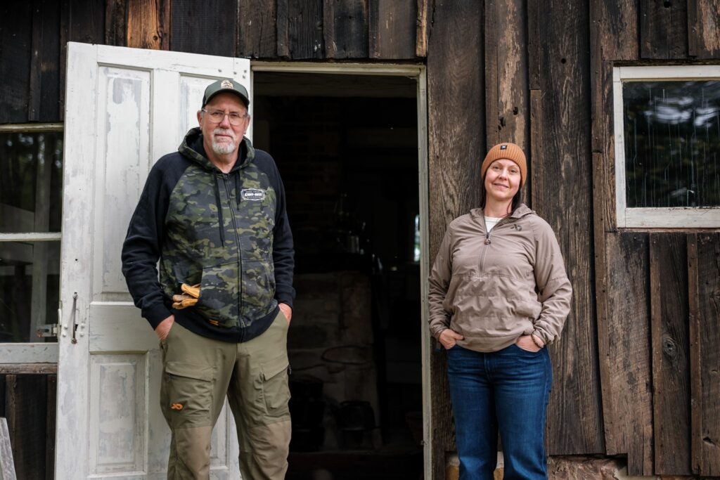 Doug Duren with Sharing The Land co-founder Lyndsey Braun in front of Aldo Leopold's Wisconsin shack. 