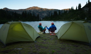 Two people camping with Nemo Equipment tents on lake
