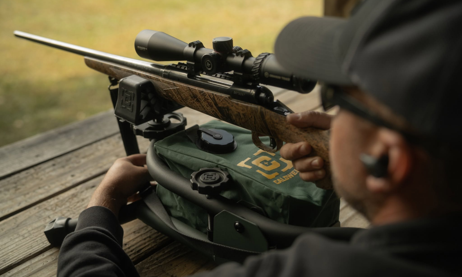 Shooting Gear Is Still on Sale for Prime Day—Up to 67% Off Rests, Red Dots, and More Man shooting rifle on Caldwell Lead Sled shooting rest