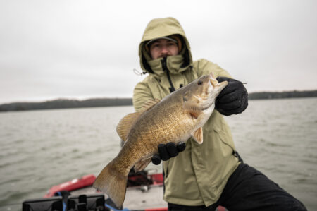 Angler holding smallmouth bass