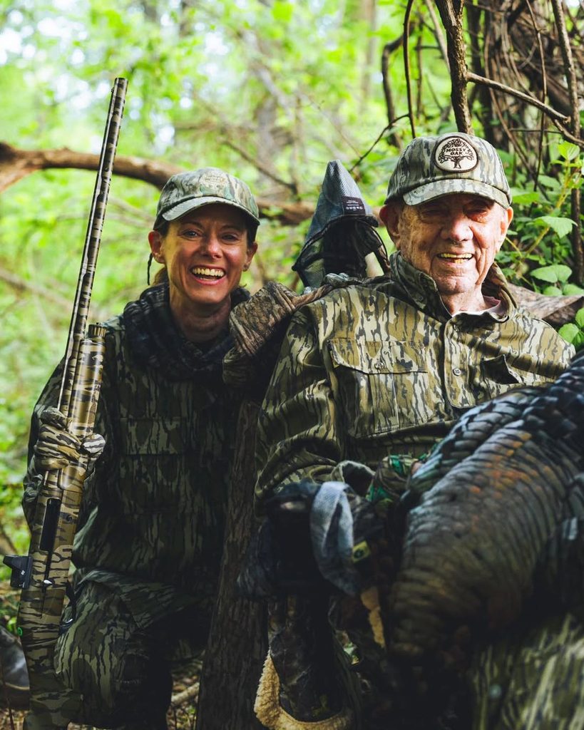 A father and daughter after a successful turkey hunt.