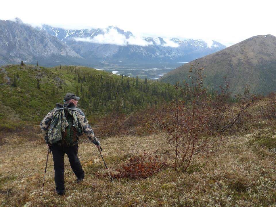 A hunter hikes through the Brooks Rnage. 
