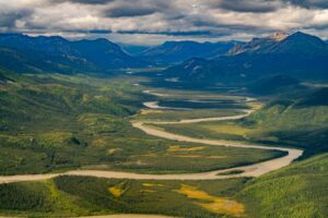 A braided river winding through a valley in Alaska's Brooks Range.