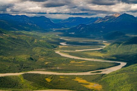 Mapping the Ambler Road A braided river winding through a valley in Alaska's Brooks Range.