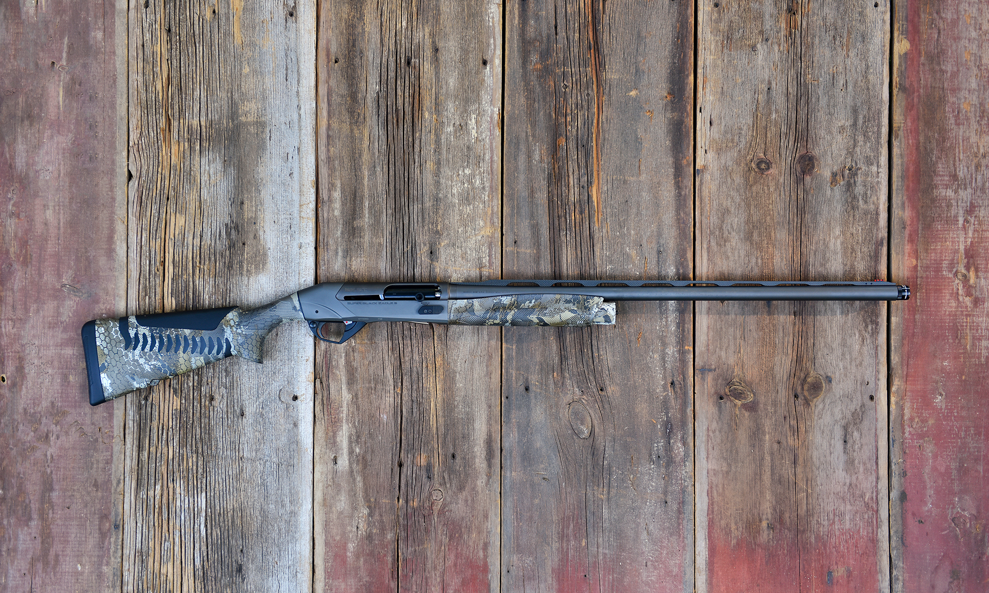 The new Benelli SBE 3 A.I. BES.T. shotgun on barn boards. 