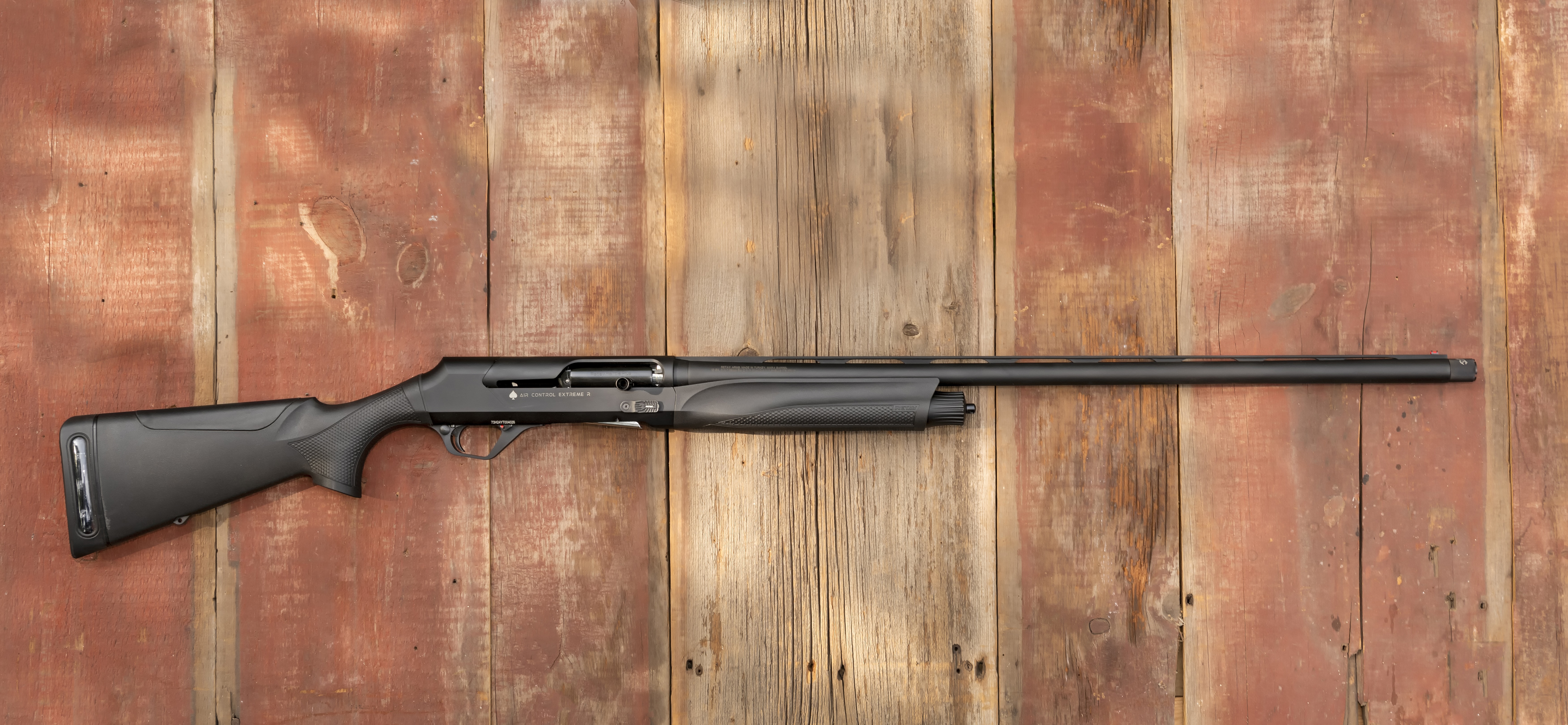 The new Retay ACE-R semiauto shotgun on a wood surface.