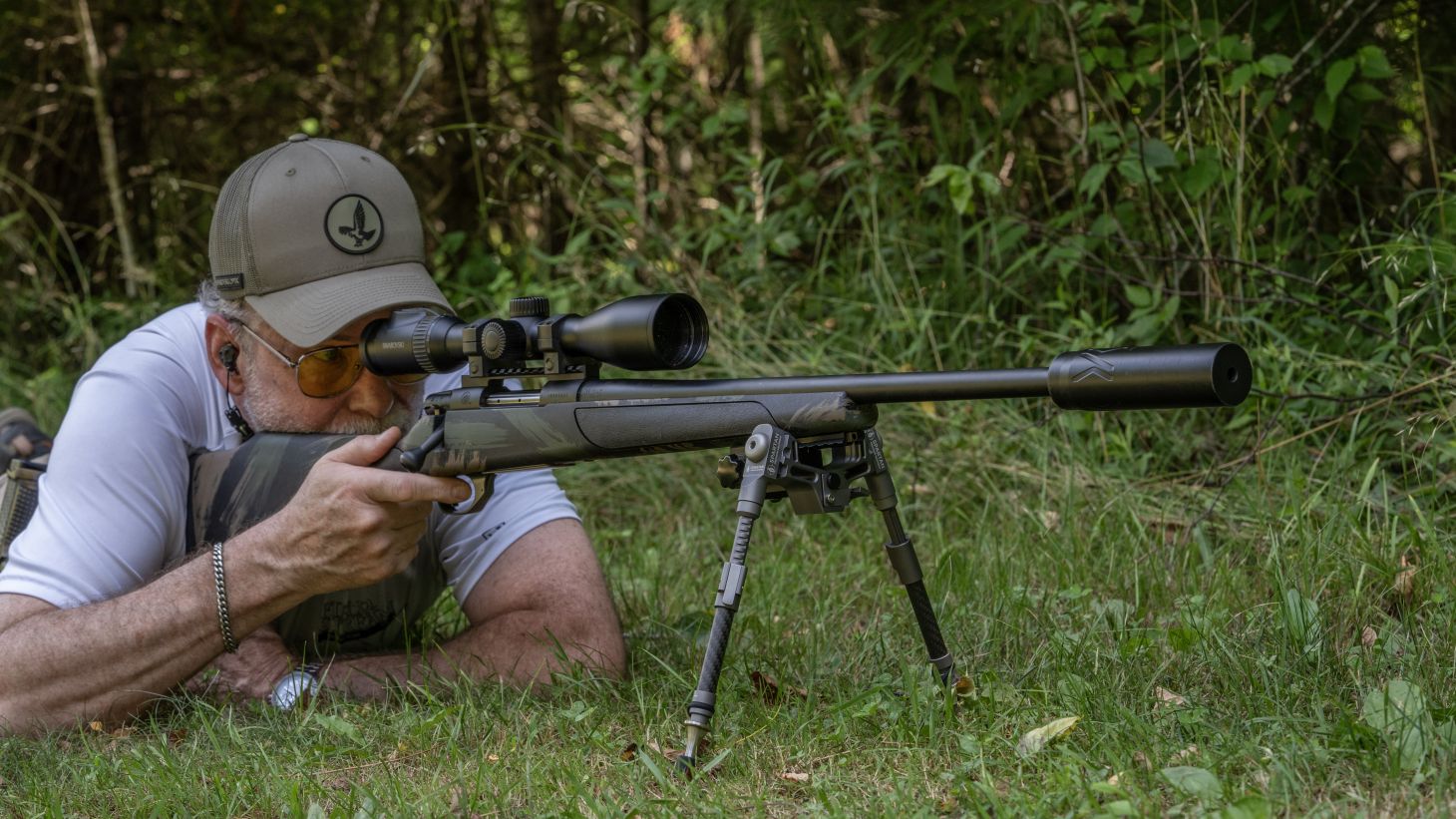 A shooter fires the new Weatherby Vanguard Black Hills rifle from the prone position. 