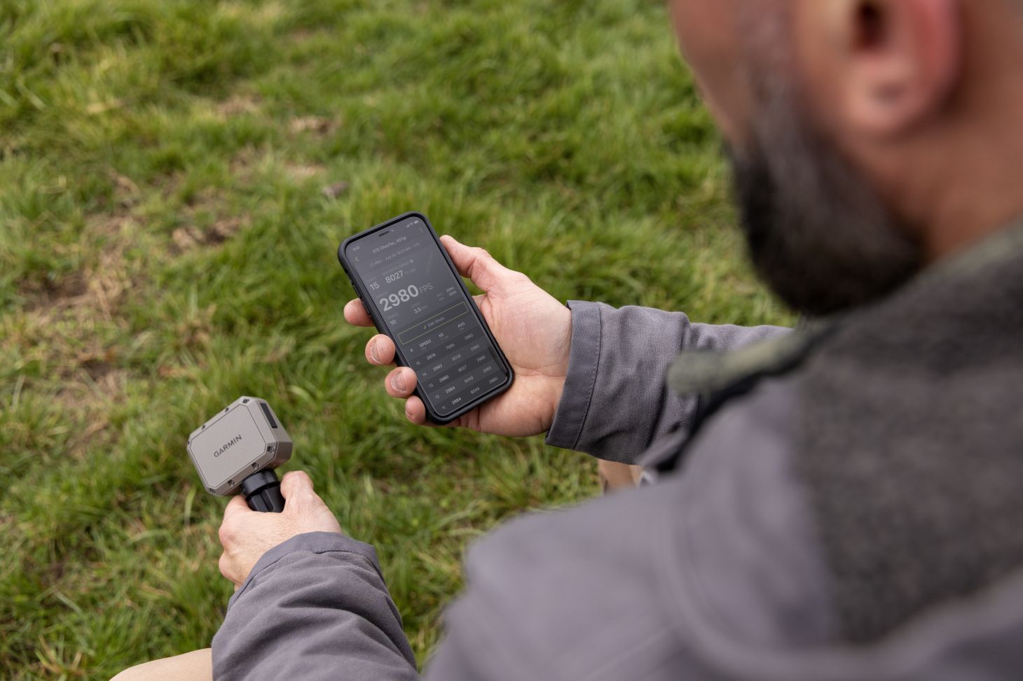 A shooter pairs his new Garmin Xero C1 Pro chronograph to his cell phone. 