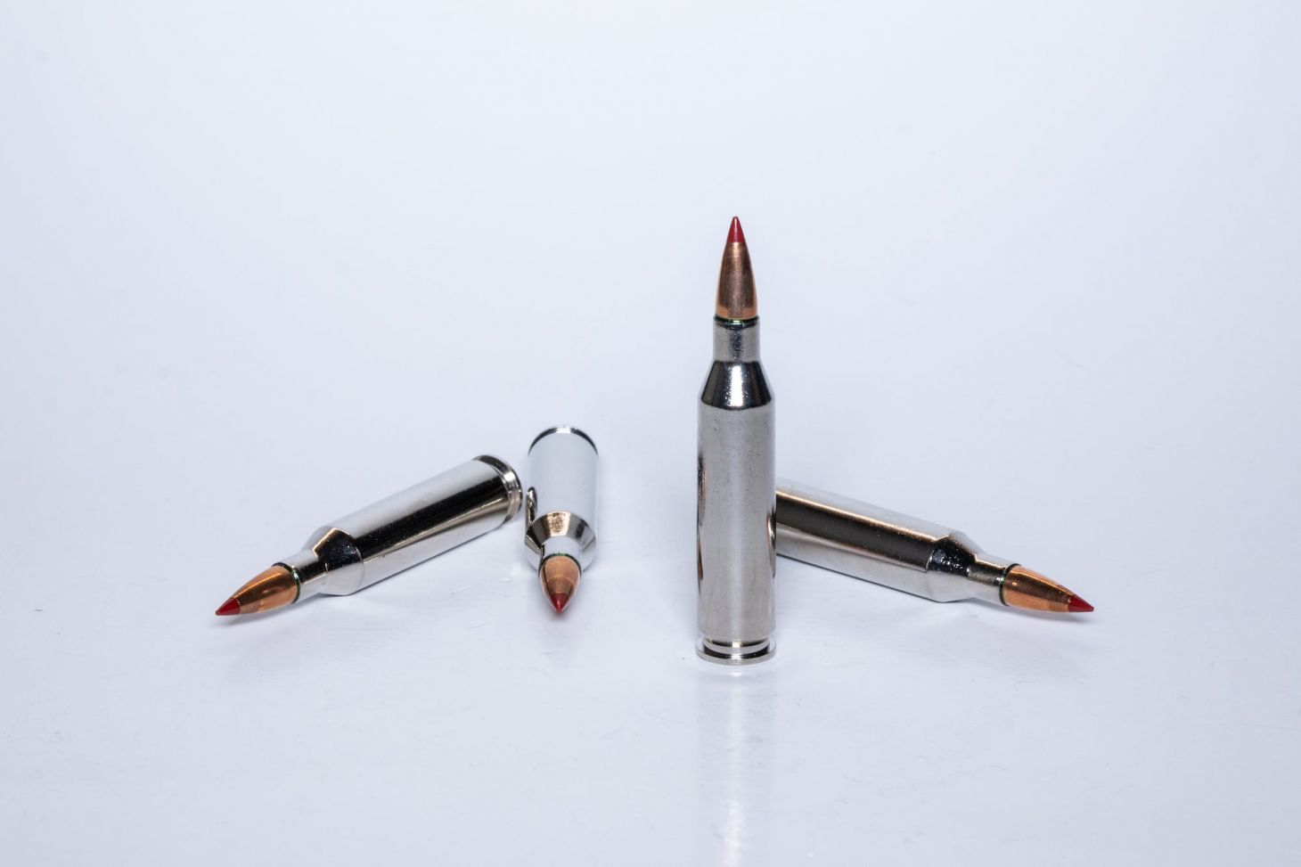 Several 243 Winchester cartridges on a white background.