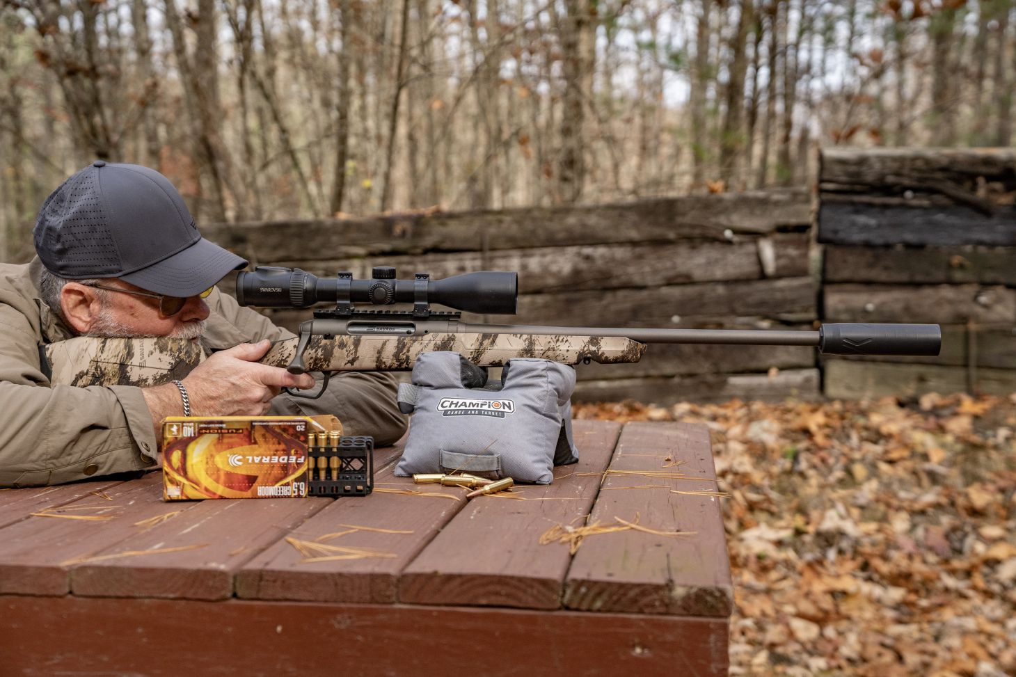 A shooter fires the new Savage Axis 2 pro rifle from a bench. 