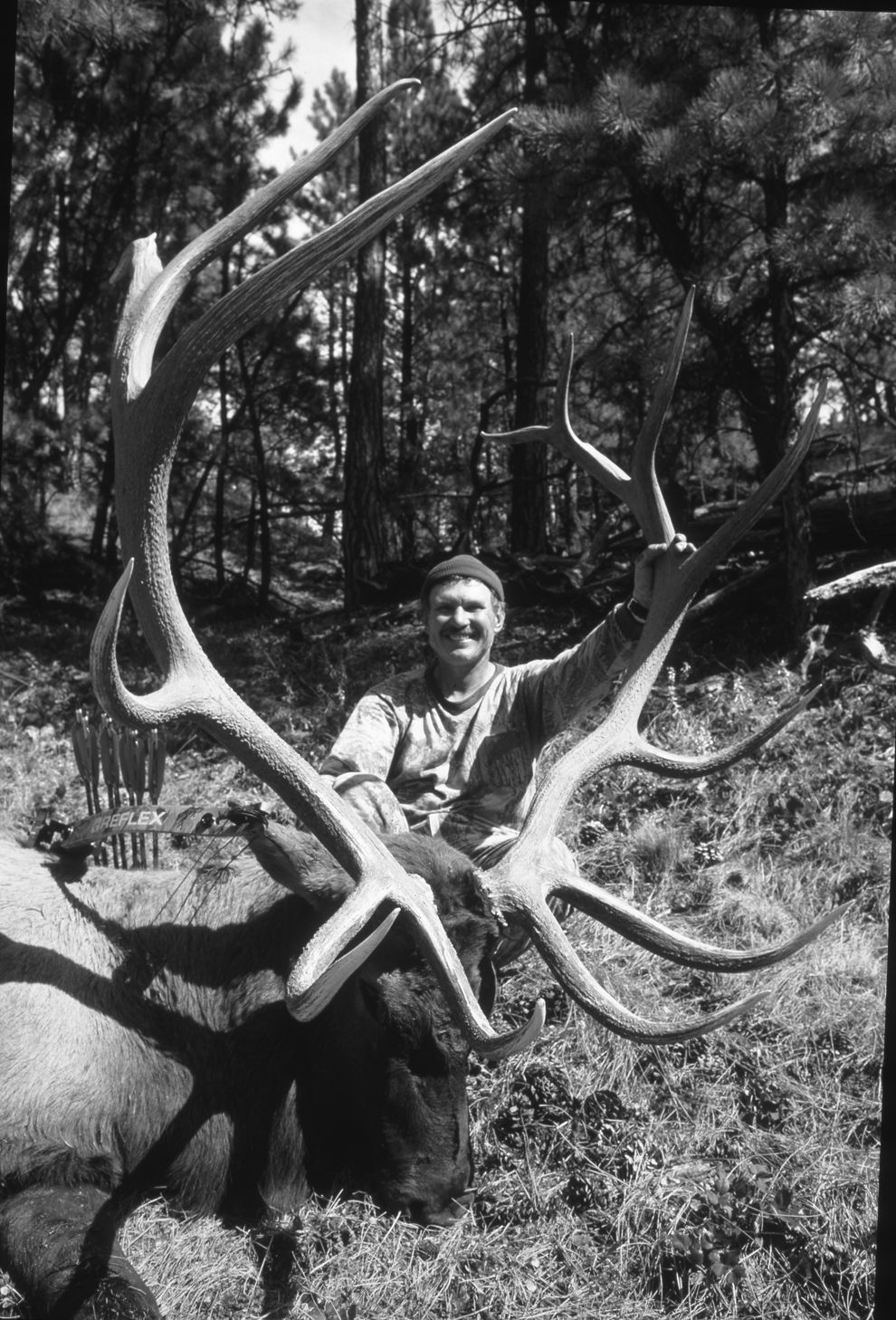 A legendary bow hunter poses with a record bull elk. 