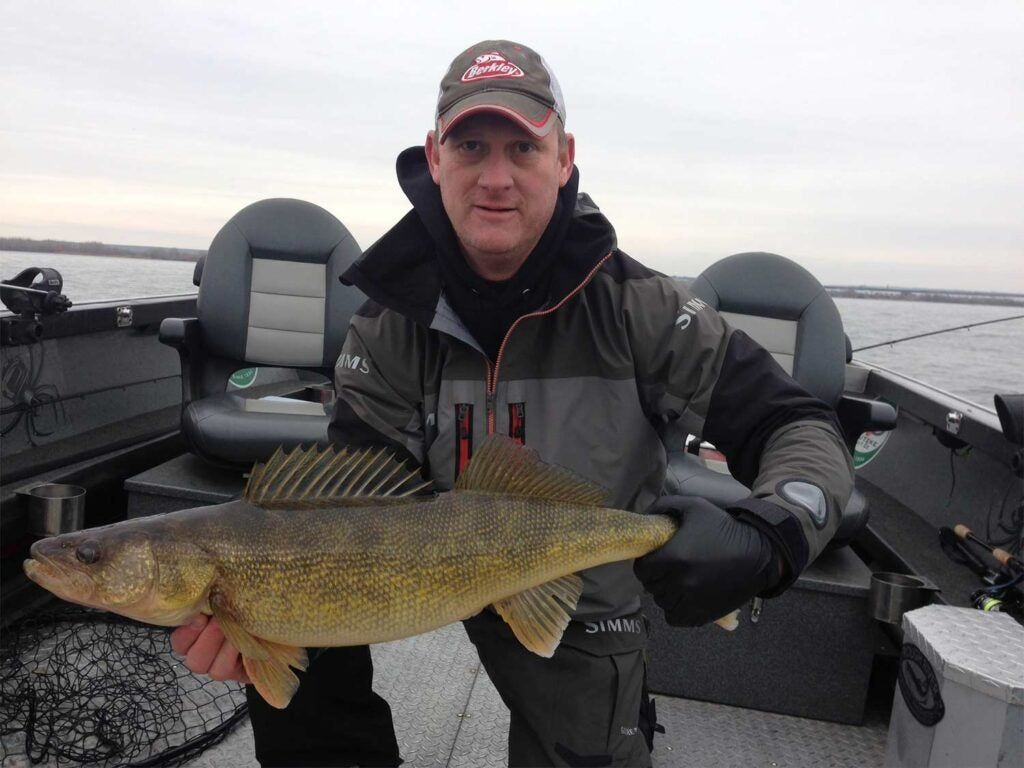 man holding a giant walleye