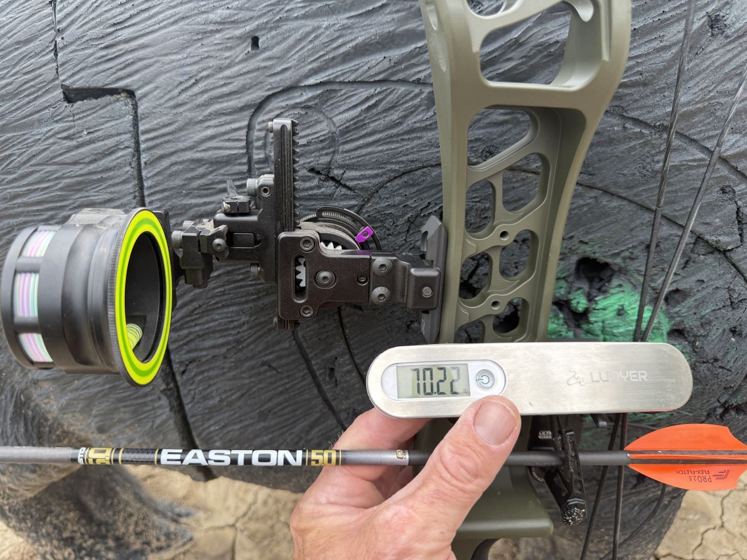 A bow scale set to 70.22 pounds for the Xpedition XLite 32 bow. 