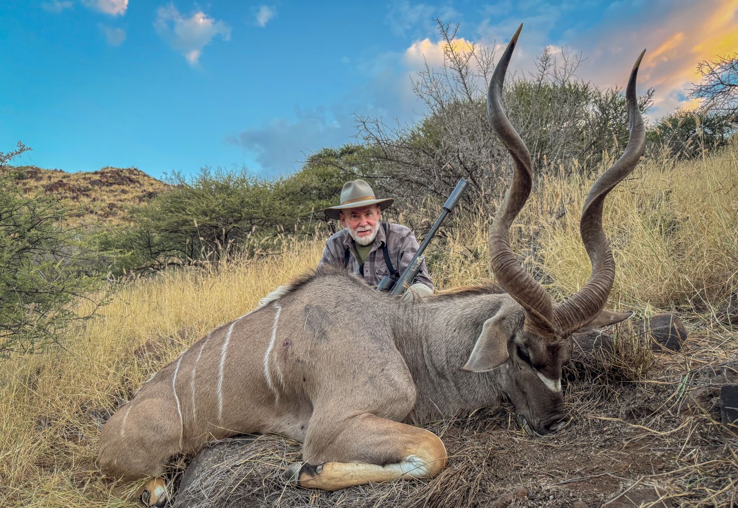 A hunter with a kudu in Africa. 