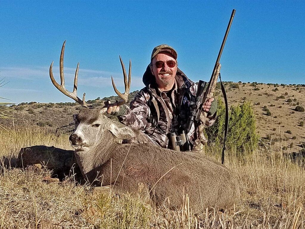 Hunter with Texas mule deer shot with Ruger American Go Wild rifle