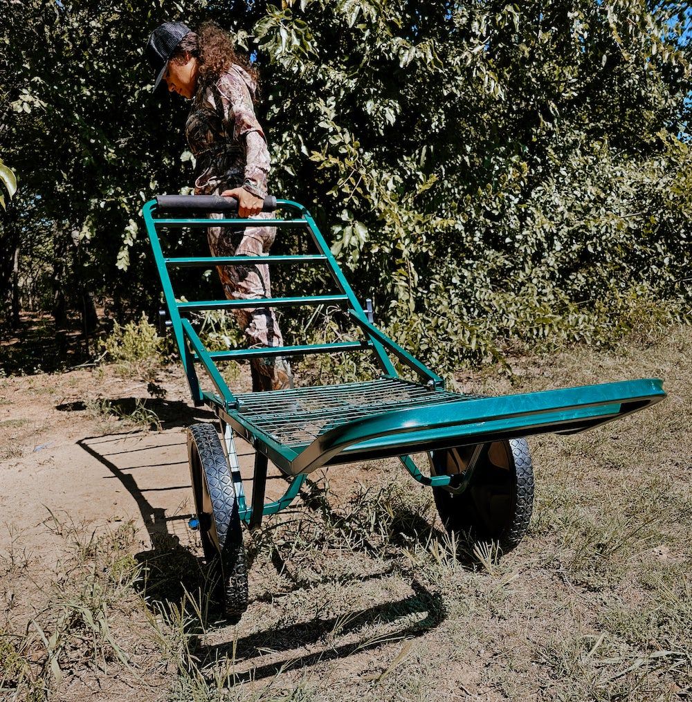 Female hunter using Cabela's deer cart