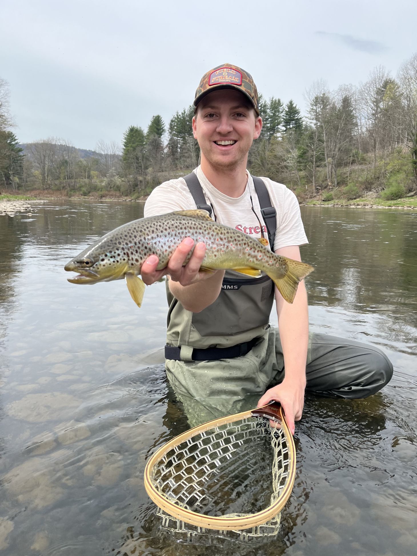 Ryan Chelius holds up brown trout