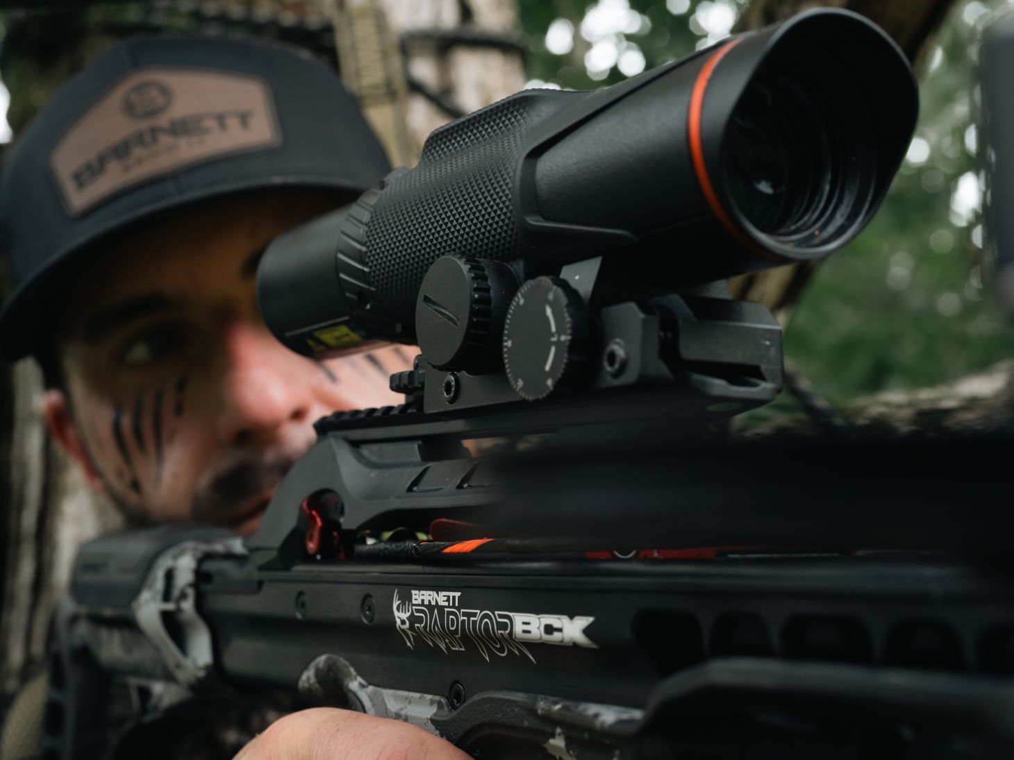 A shooter aiming through the scope of the new Hyper Raptor BCX BukOps crossbow. 