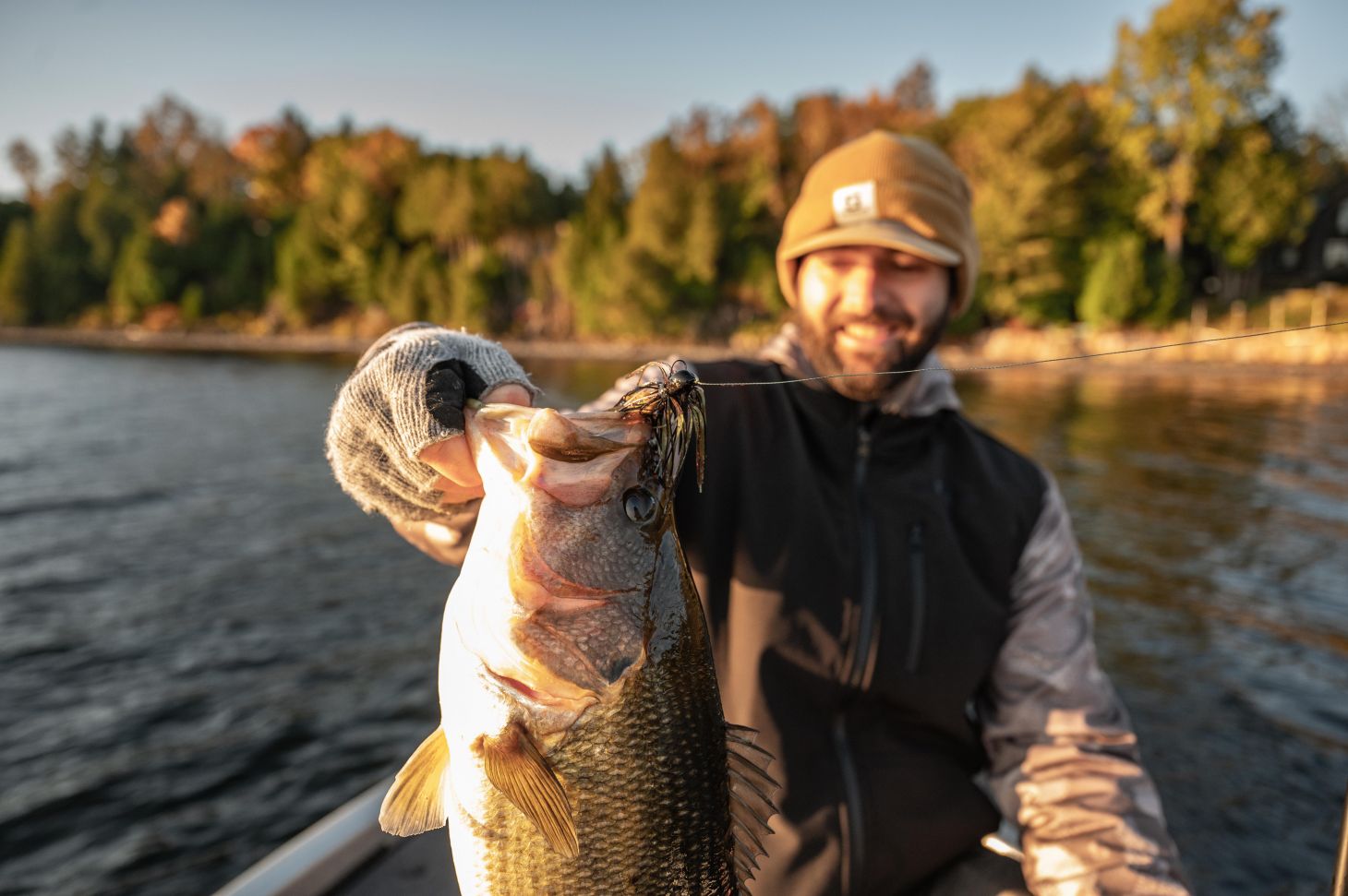 Angler holds up largemouth bass