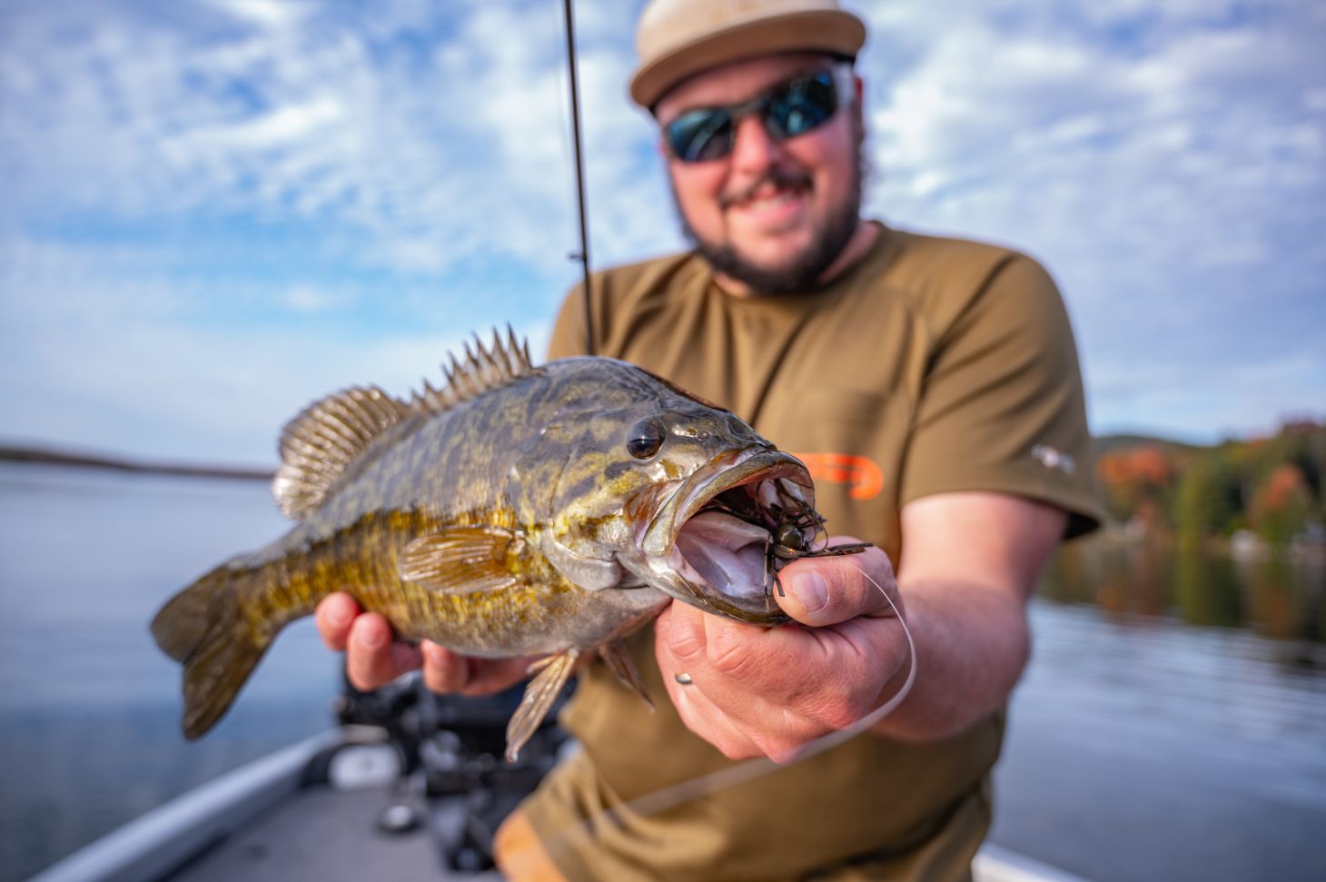 Angler holds smallmouth bass
