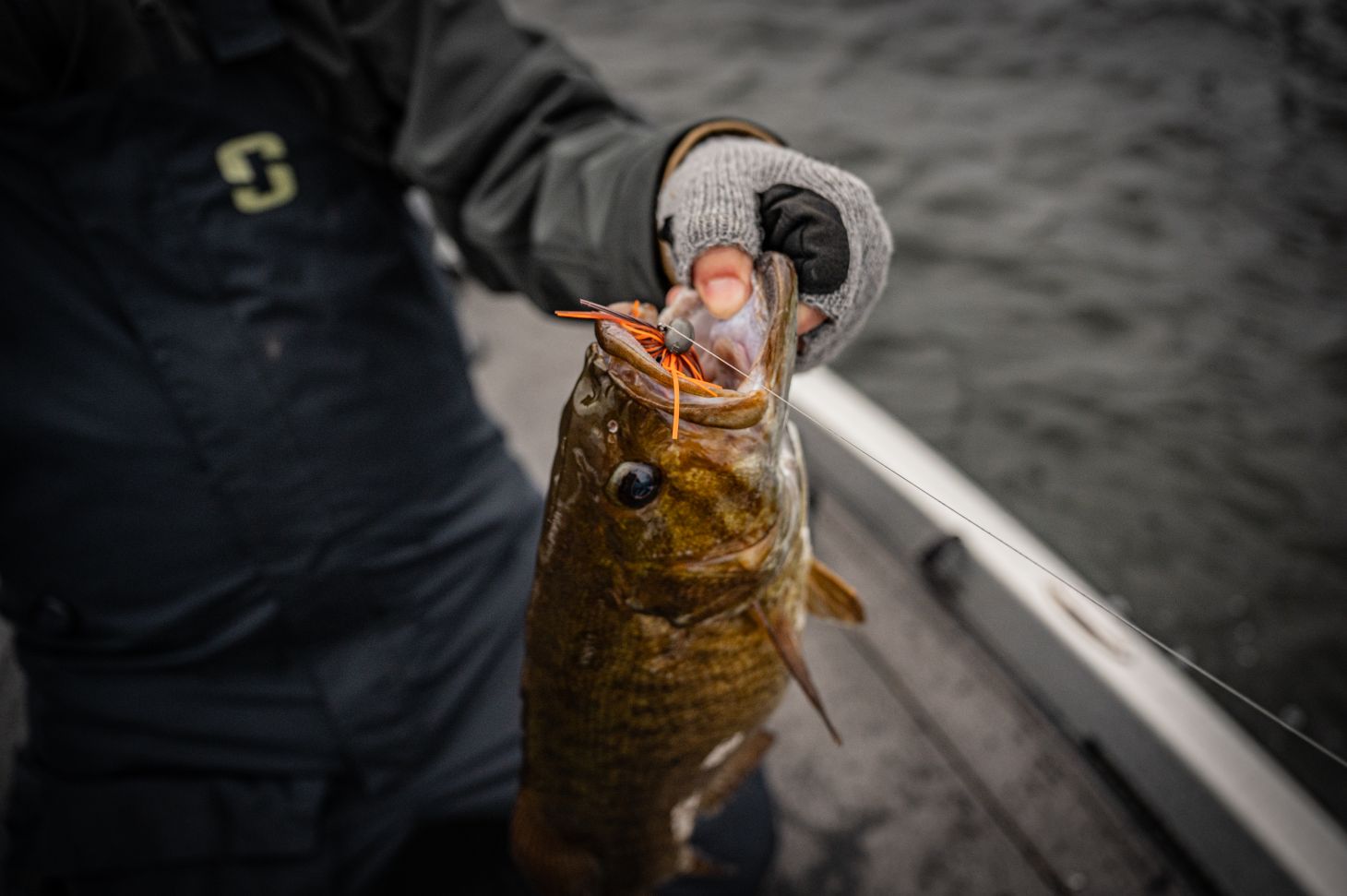 Angler holding smallmouth bass
