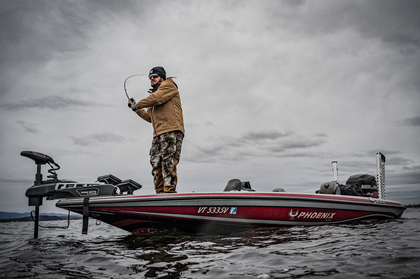 Fisherman making cast from boat