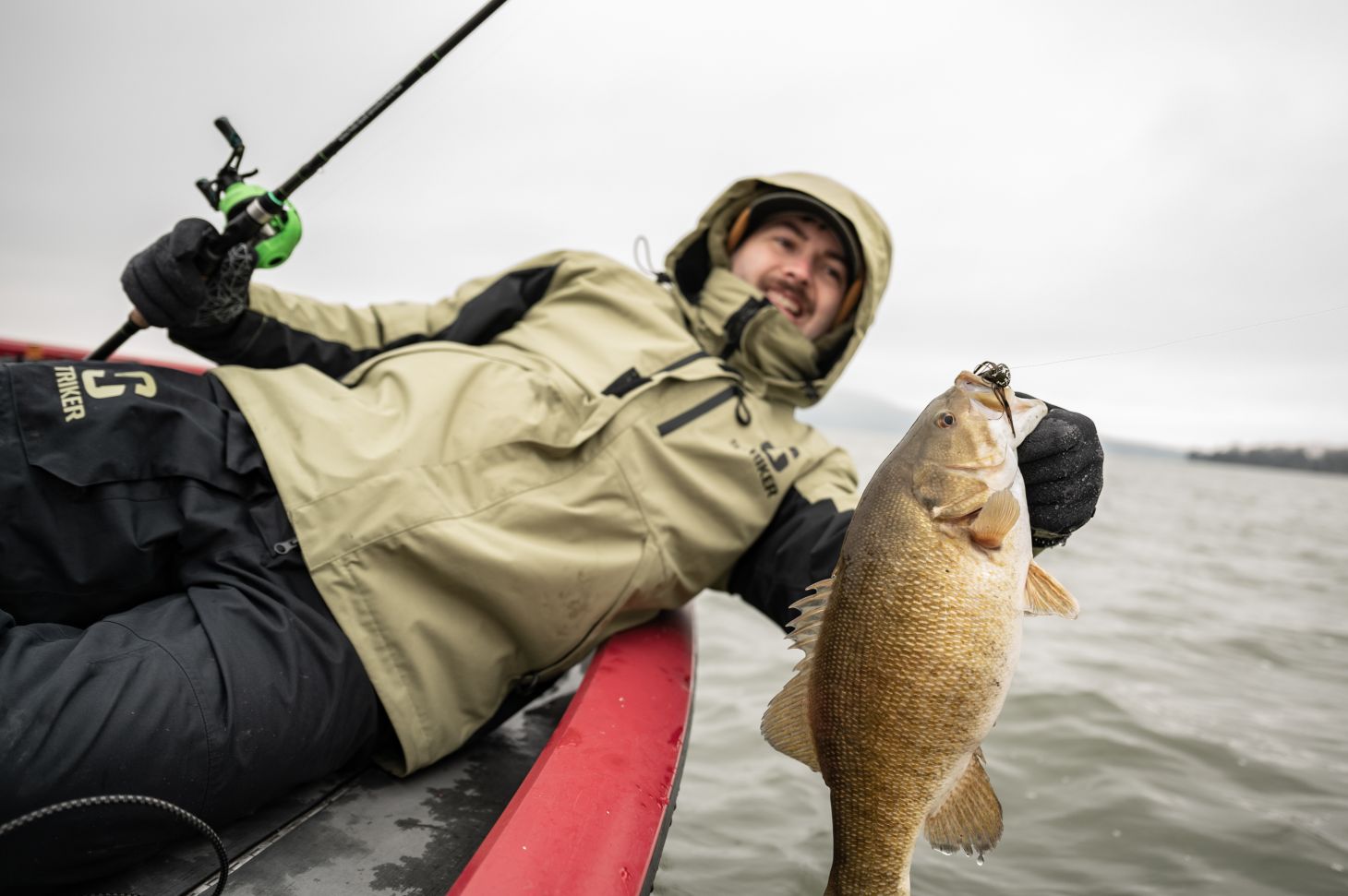 Angler with two smallmouth bass